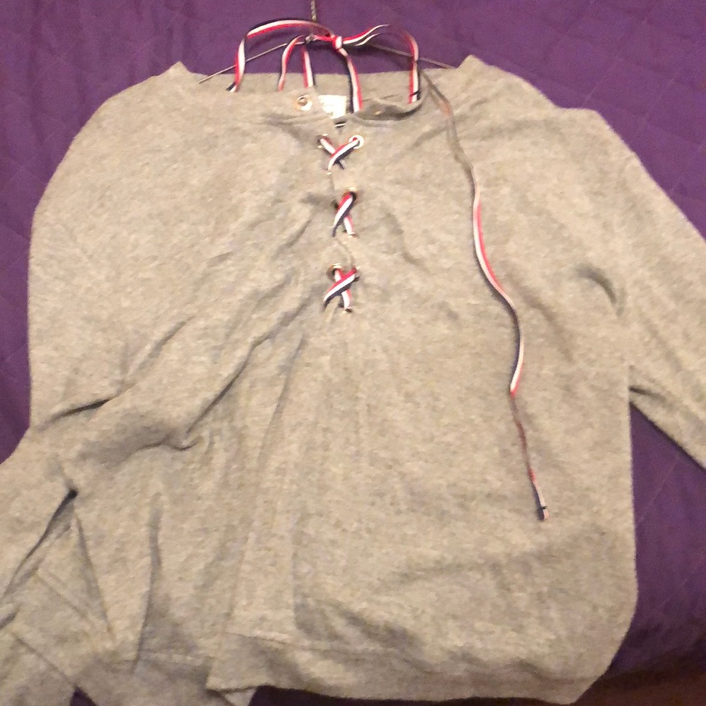 Grey shirt with red white and blue details